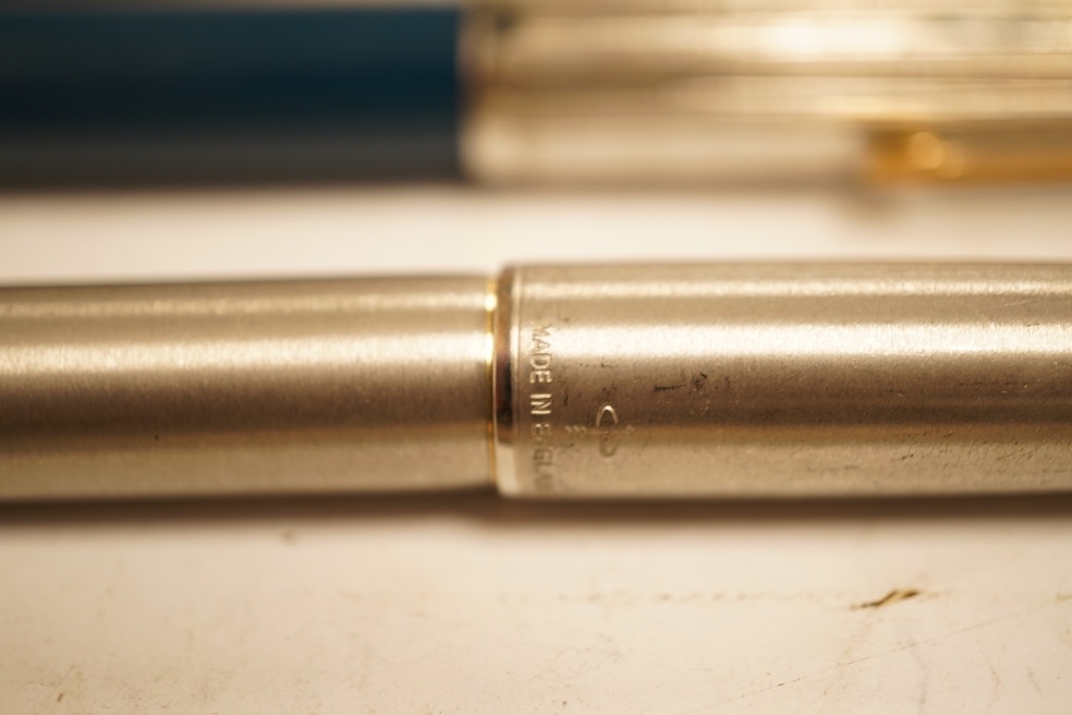 A Sheaffer 'White Spot' fountain pen with 14K gold nib and chevron decoration and three other pens